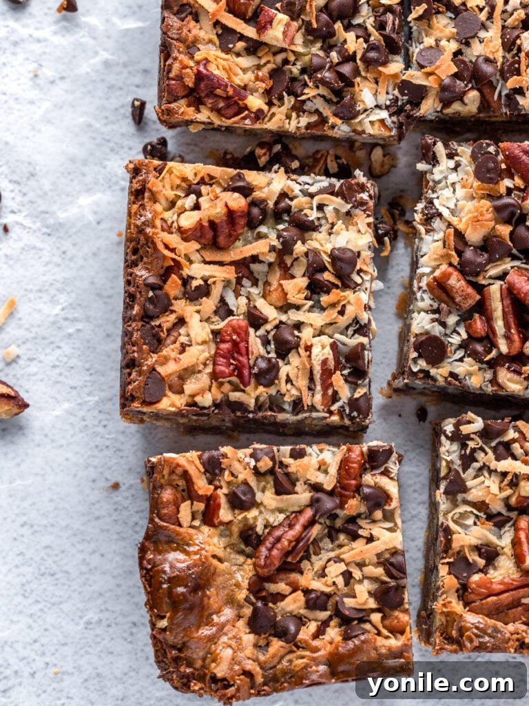 Top down photo showing several pieces of sliced Magic Bars, revealing the multi-layered texture and inviting appearance.