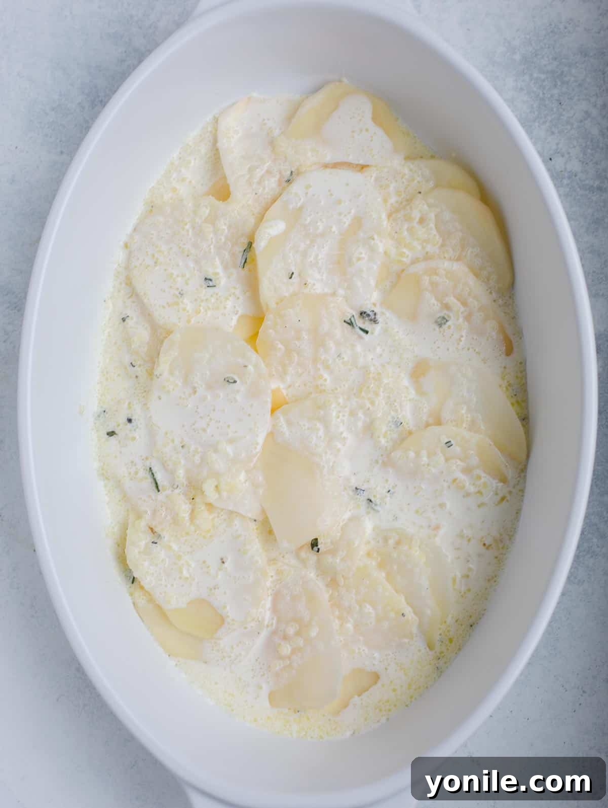Simple Cheesy Potato Bake 6 step showing how to assemble au gratin potato