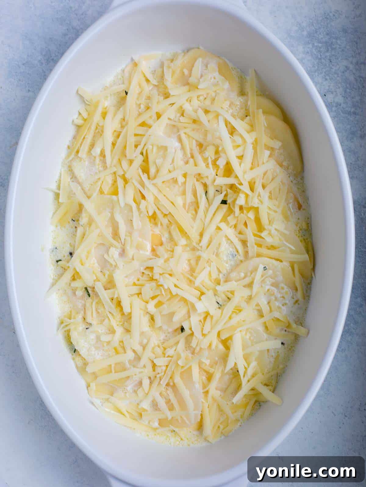 Simple Cheesy Potato Bake 7 step showing how to assemble au gratin potato