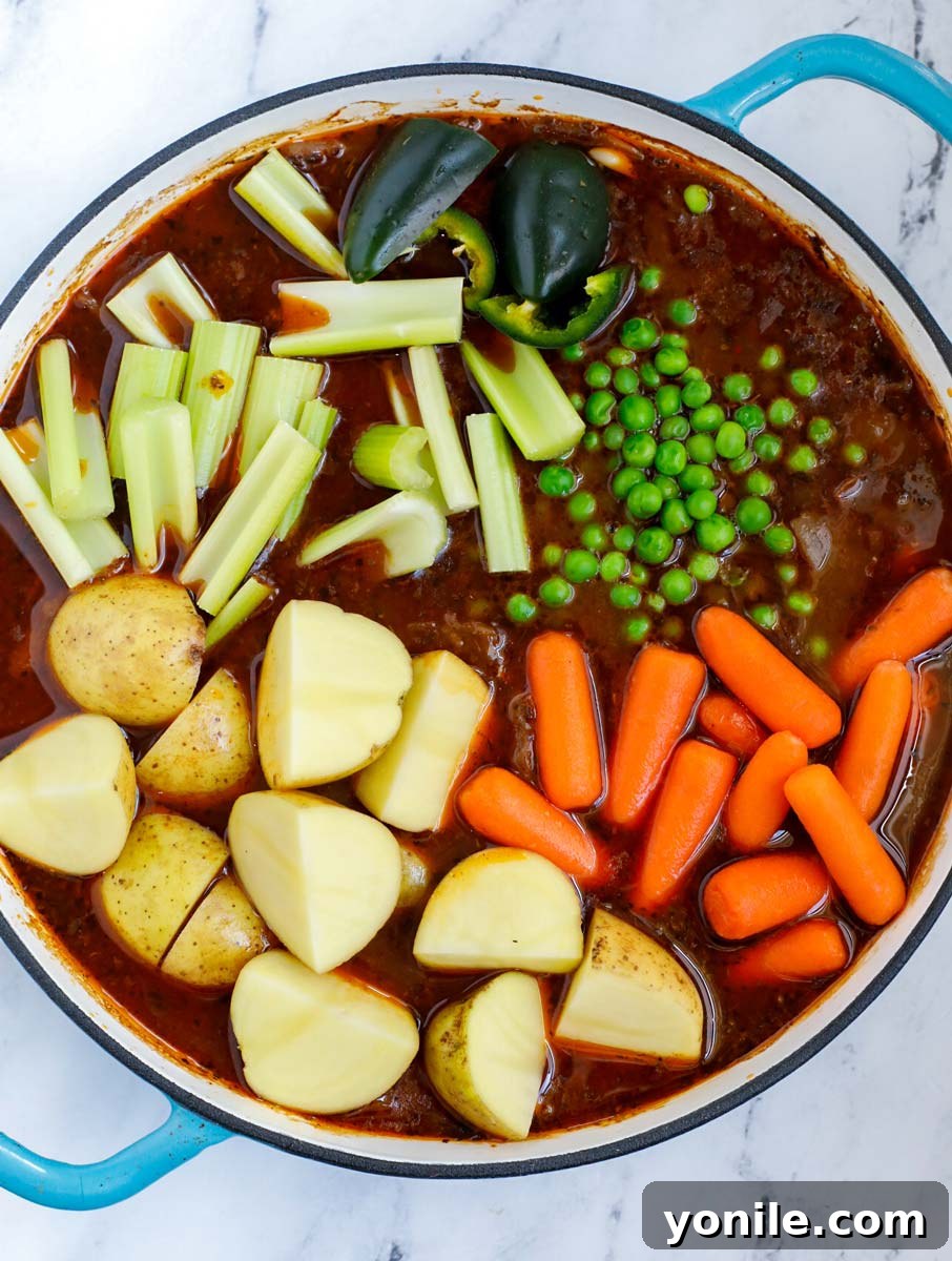 Veggies added into the beef stew