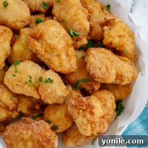 Homemade Chicken Nuggets: Crispy, Juicy, Perfect 9 Top down view of crispy homemade chicken nuggets.