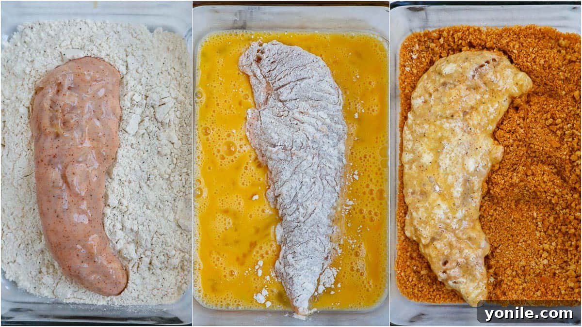Close-up of a perfectly baked crispy chicken tender, showing the delicious golden-brown crust.