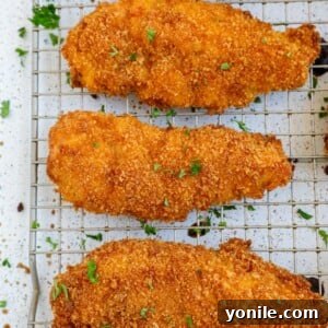 crispy baked chicken tenders on a baking rack