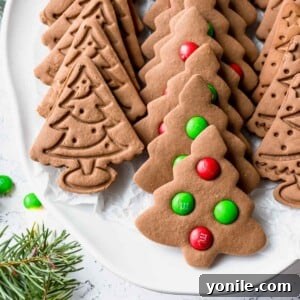 christmas tree gingerbread cookies on a white plate