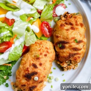 Creamy Jalapeño Chicken Popper 16 Top down shot of stuffed chicken with salad.