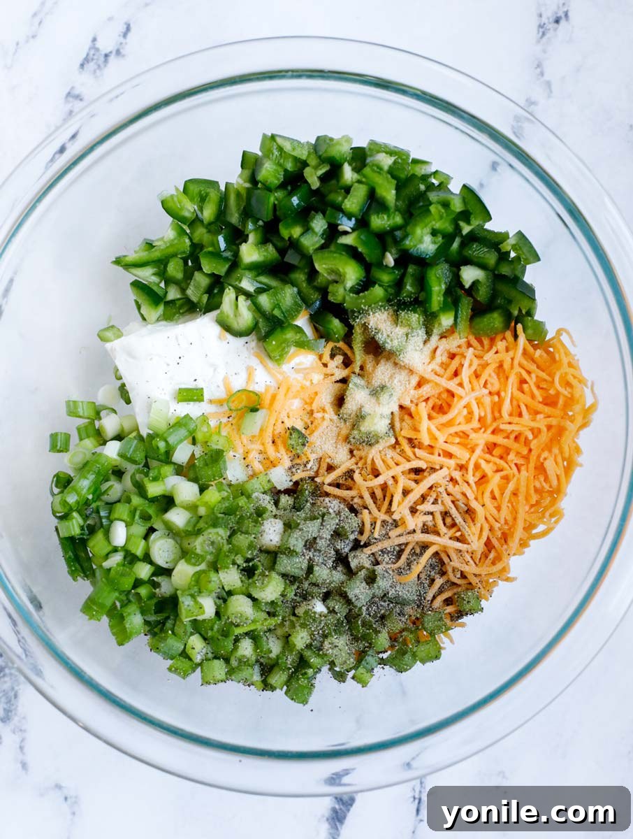 Creamy Jalapeño Chicken Popper 4 Stuffing ingredients in a bowl before mixing.