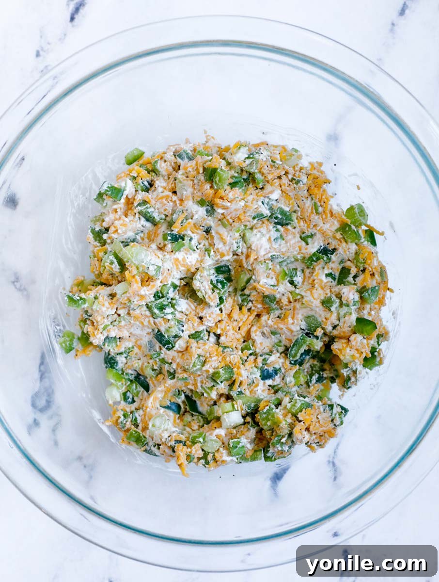 Creamy Jalapeño Chicken Popper 5 Stuffing ingredients perfectly mixed in a bowl, ready to be used.