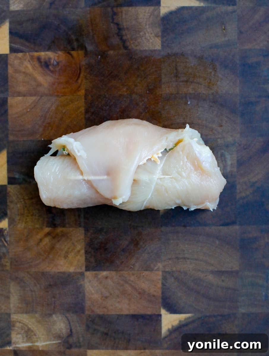 Creamy Jalapeño Chicken Popper 8 Rolled chicken breast, neatly stuffed and ready for coating.