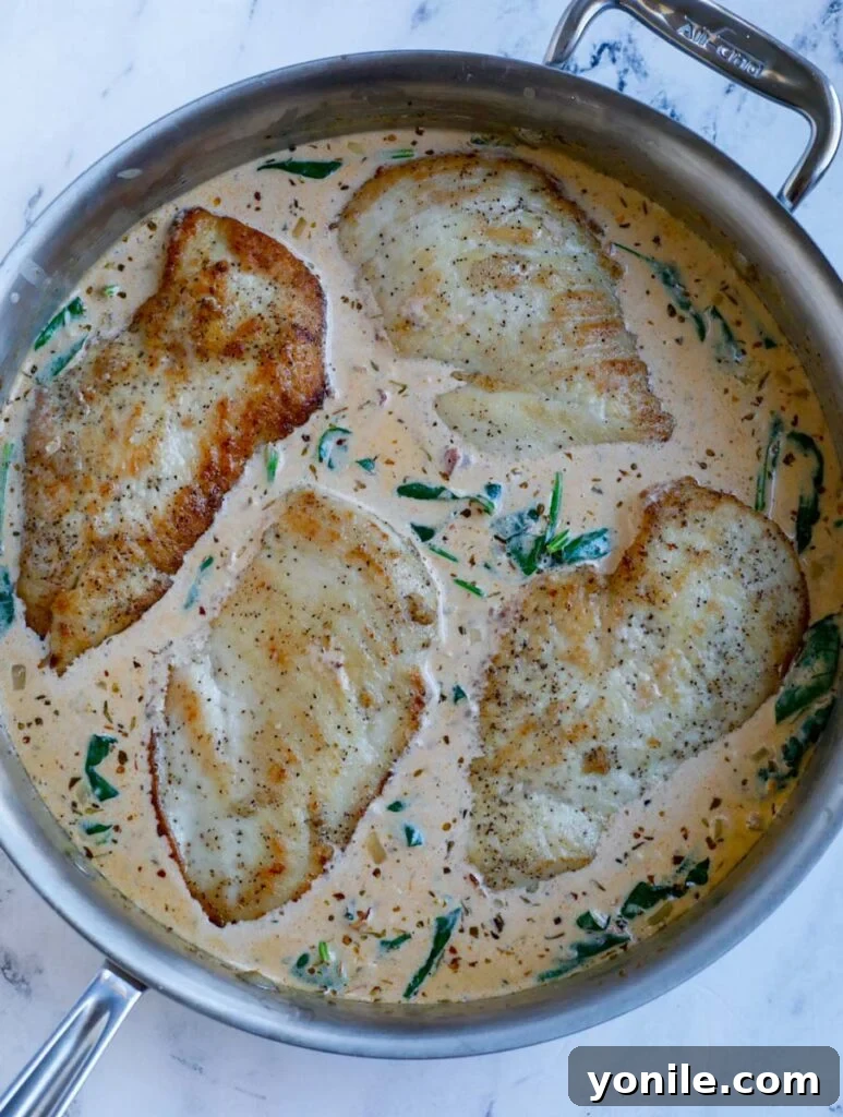 Chicken in a pot with cream.