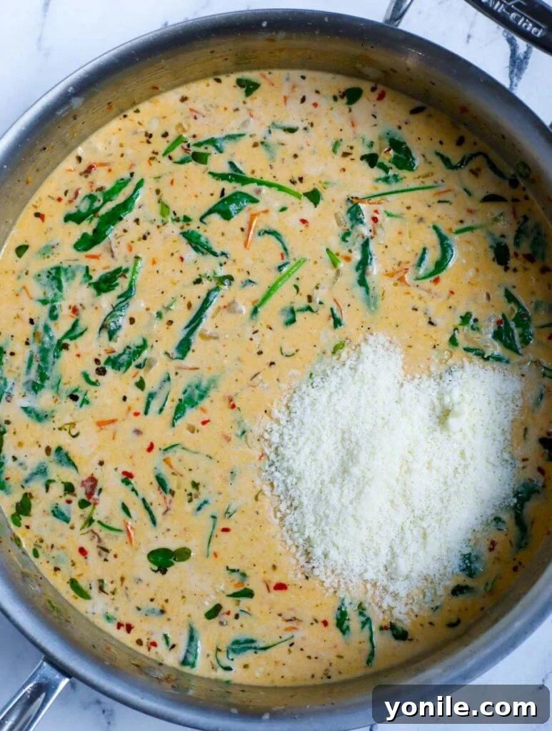 Creamy sauce with spinach and parmesan cheese stirred in.