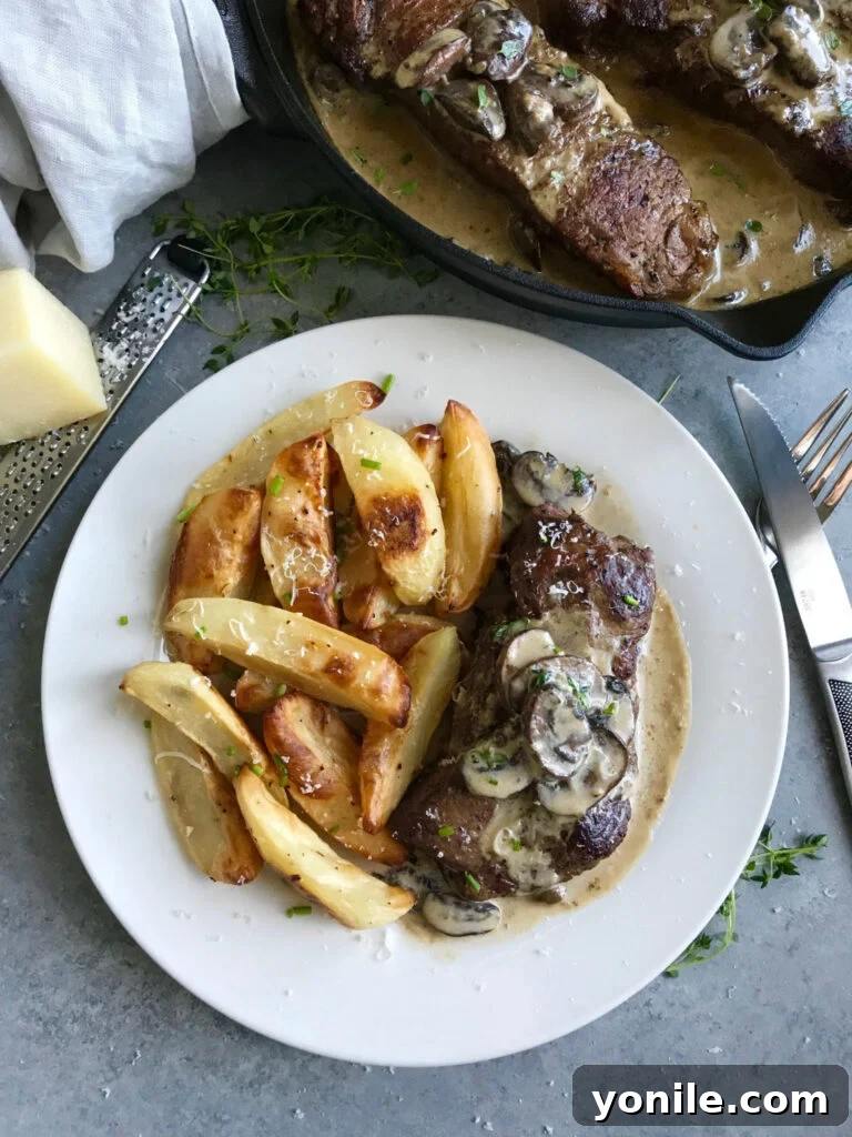 Another angle of creamy mushroom steak with garnishes
