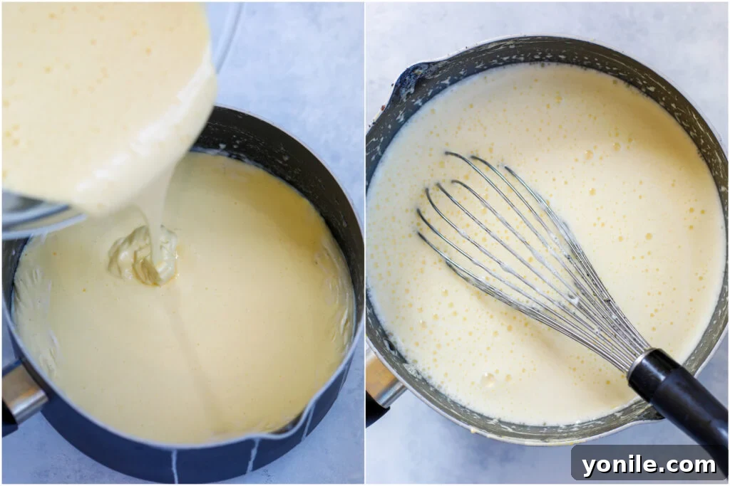A whisk blending the custard mixture in a pan, achieving a smooth consistency.