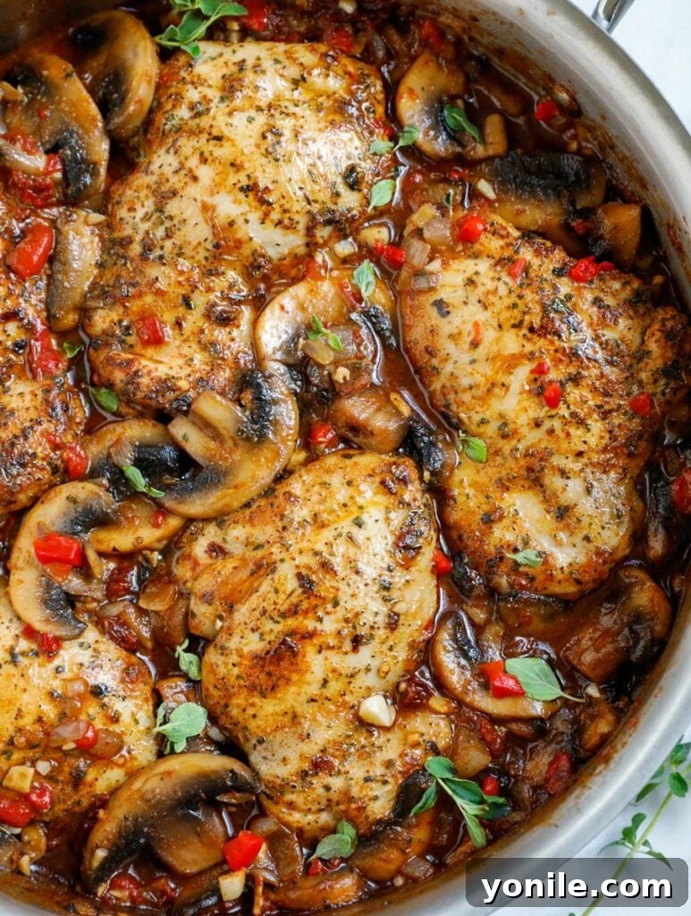 Top down shot of tuscan chicken in a pot.