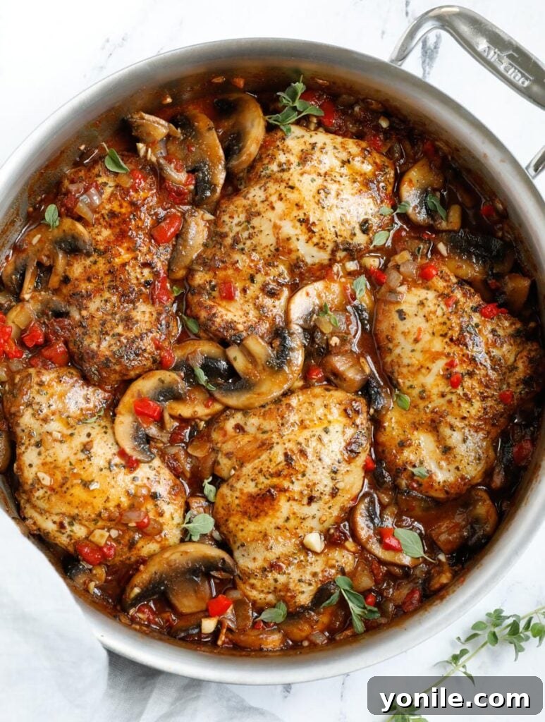 Top down shot of tuscan chicken in a skillet.