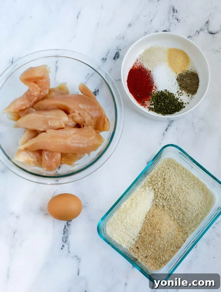 All the fresh ingredients laid out for making crispy air fryer chicken strips.