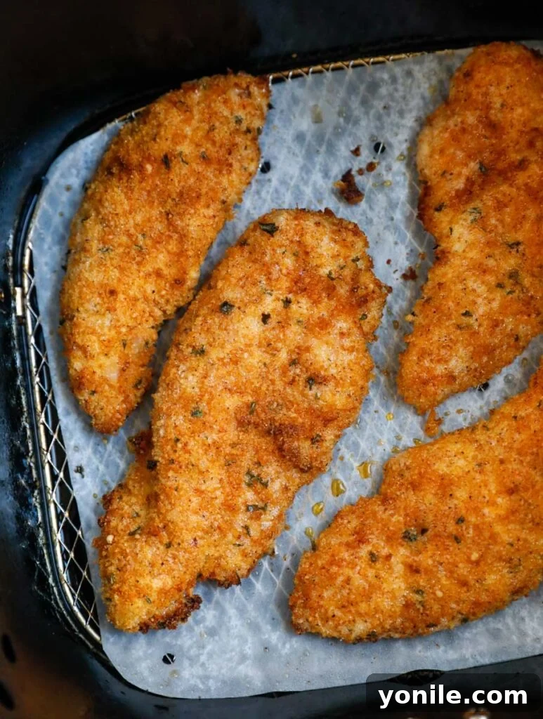 Perfectly crispy chicken strips fresh out of the air fryer.