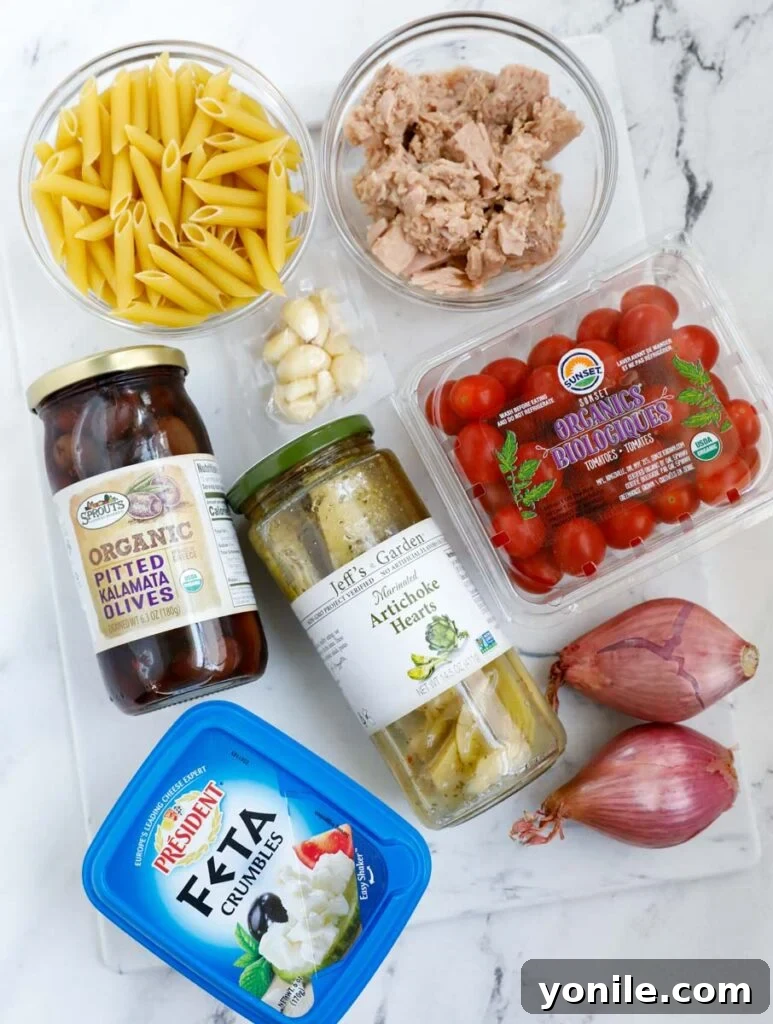 Mediterranean Tuna Pasta Salad 3 Overhead shot of fresh ingredients laid out for making a Greek tuna pasta salad.