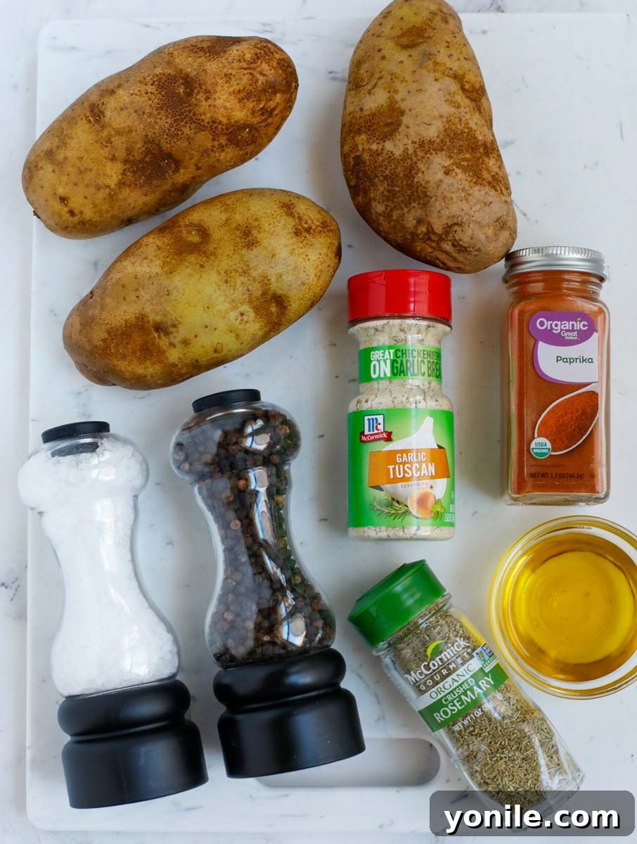 Crispy Air Fryer Potato Cubes 3 A collection of ingredients laid out, including russet potatoes, olive oil, and various spices, ready for making crispy air fryer potatoes.