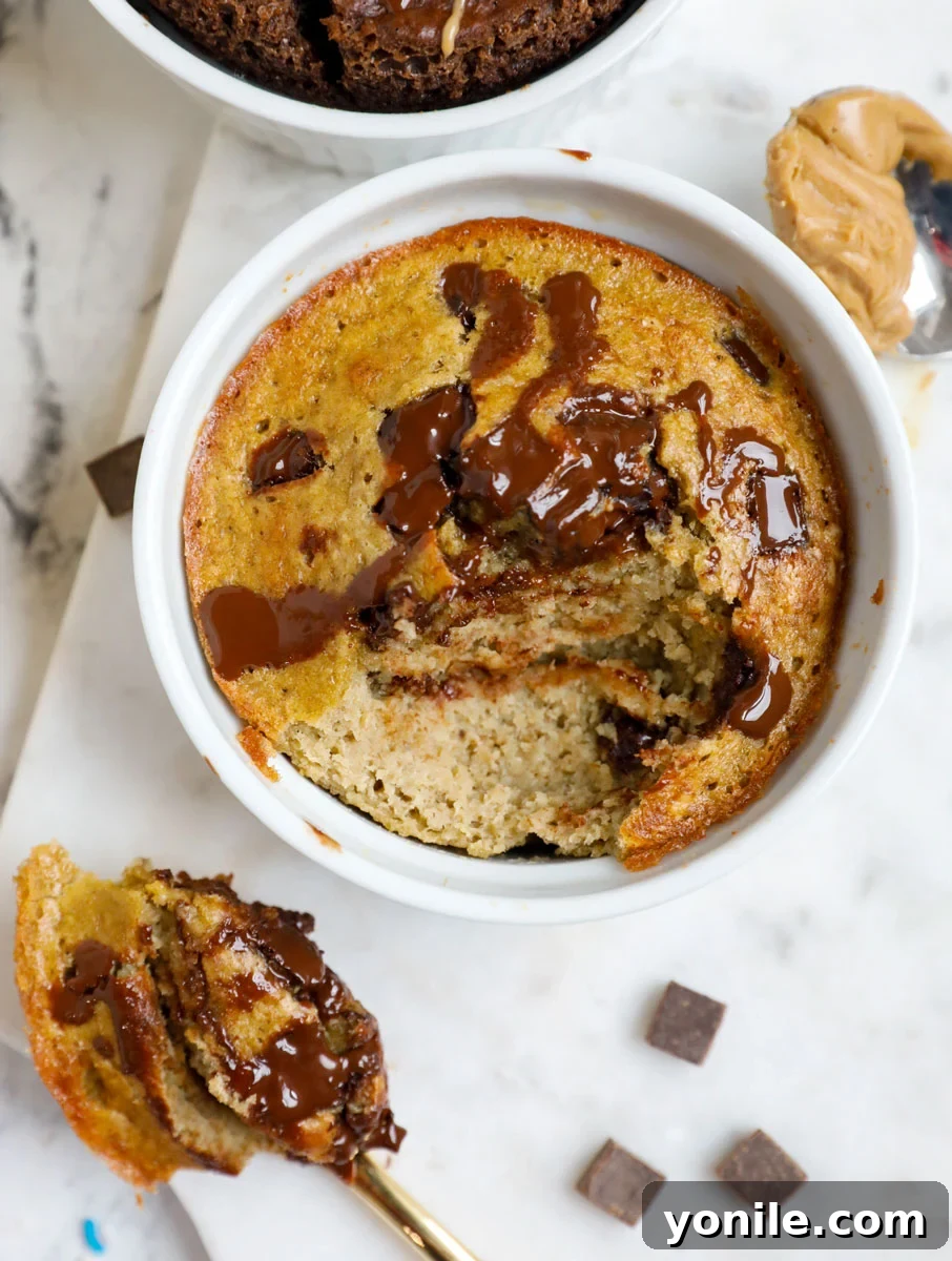 Spoonful of chocolate chip banana baked oats scooped out, showing the cake-like texture.