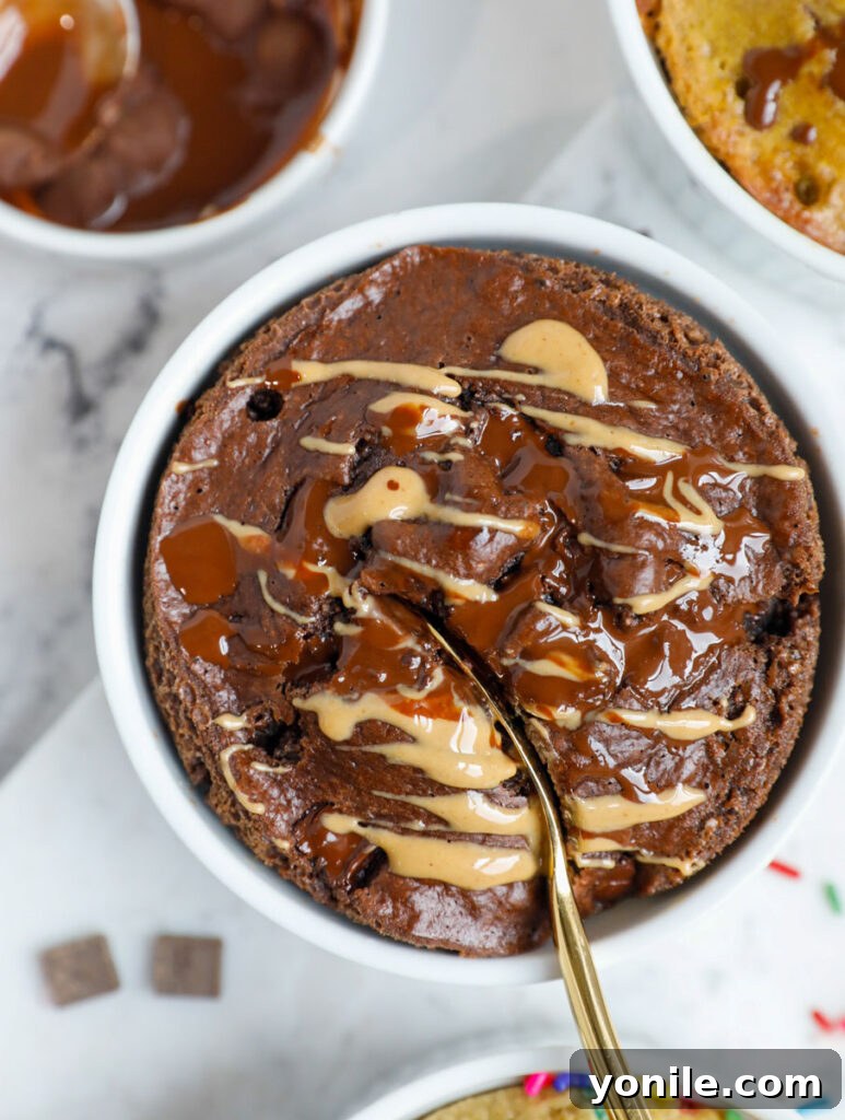 A spoon inserted into a ramekin of baked oats.