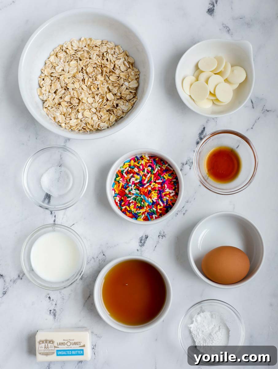 3 Irresistible Baked Oats Recipes 3 Ingredients laid out to prepare Tik Tok viral funfetti baked oats, featuring colorful sprinkles and white chocolate.