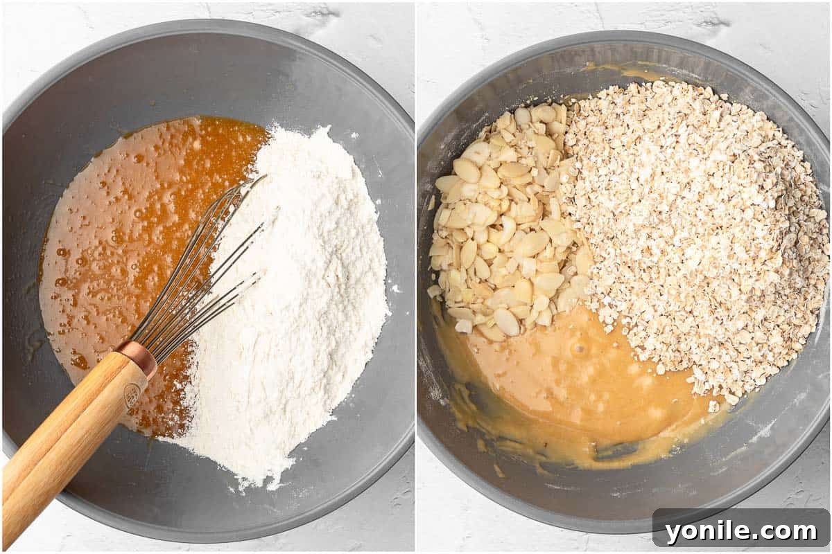 The process of combining wet and dry ingredients in a bowl to form the crispy almond oatmeal cookie dough.