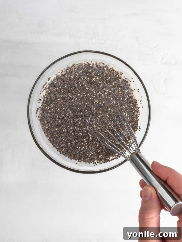 chia being mixed into almond milk