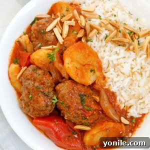 Kafta and potato stew served with vermicelli rice, indicating a complete meal.