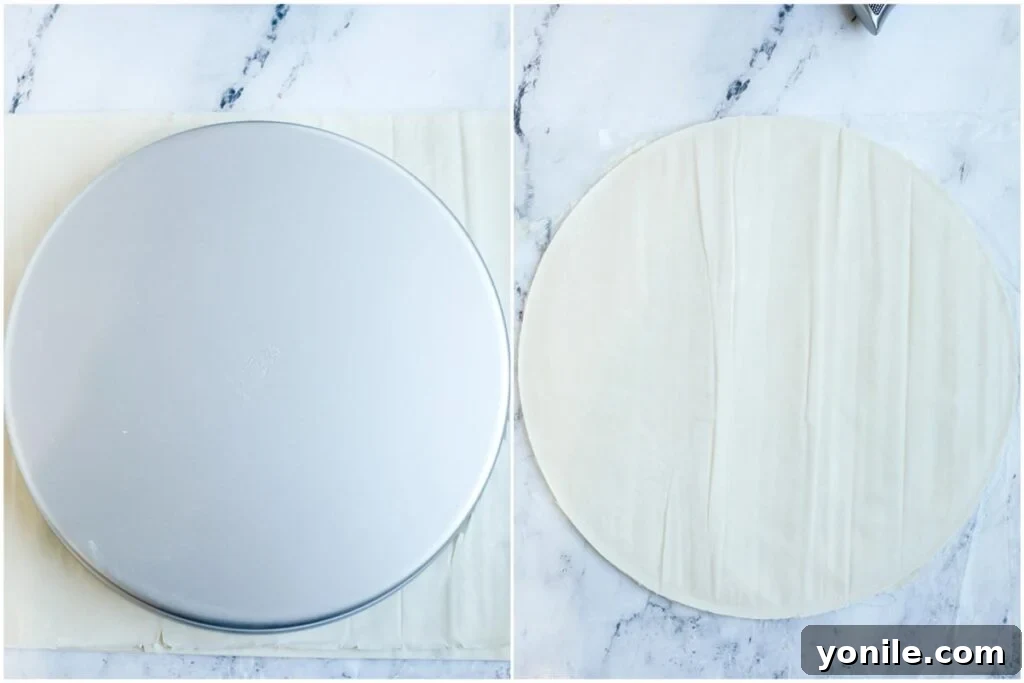 A baking pan placed on top of a stack of phyllo dough, serving as a guide to cut the sheets to the correct size.