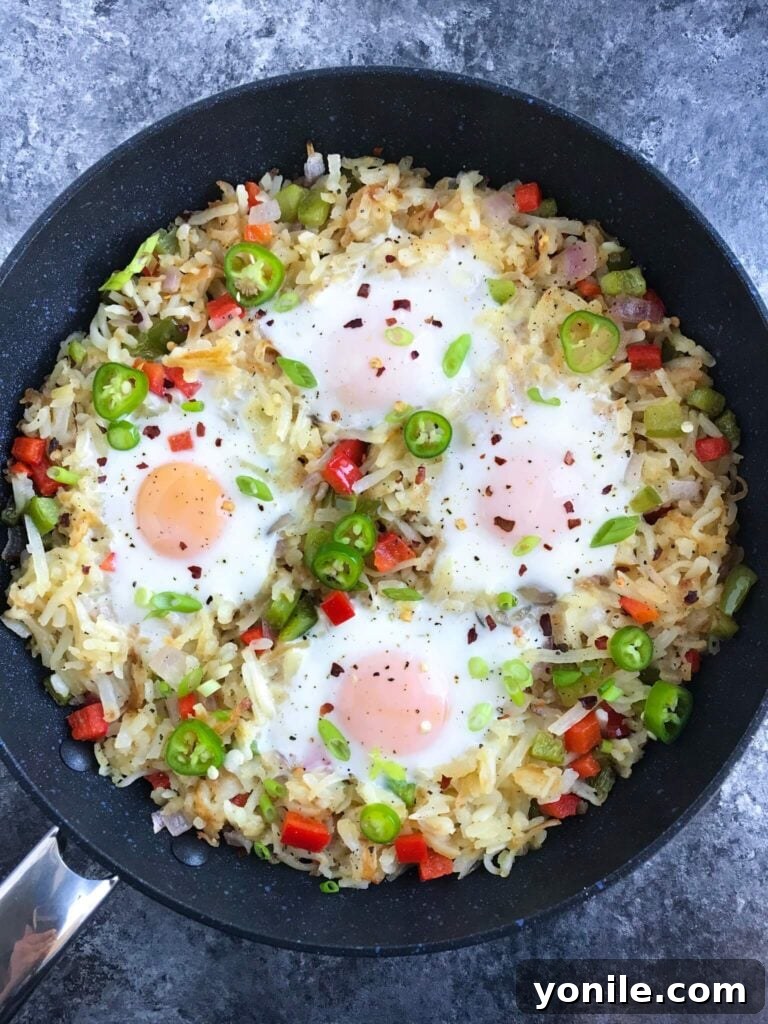 Delicious Veggie Hashbrown Skillet with Sunny Side Up Eggs