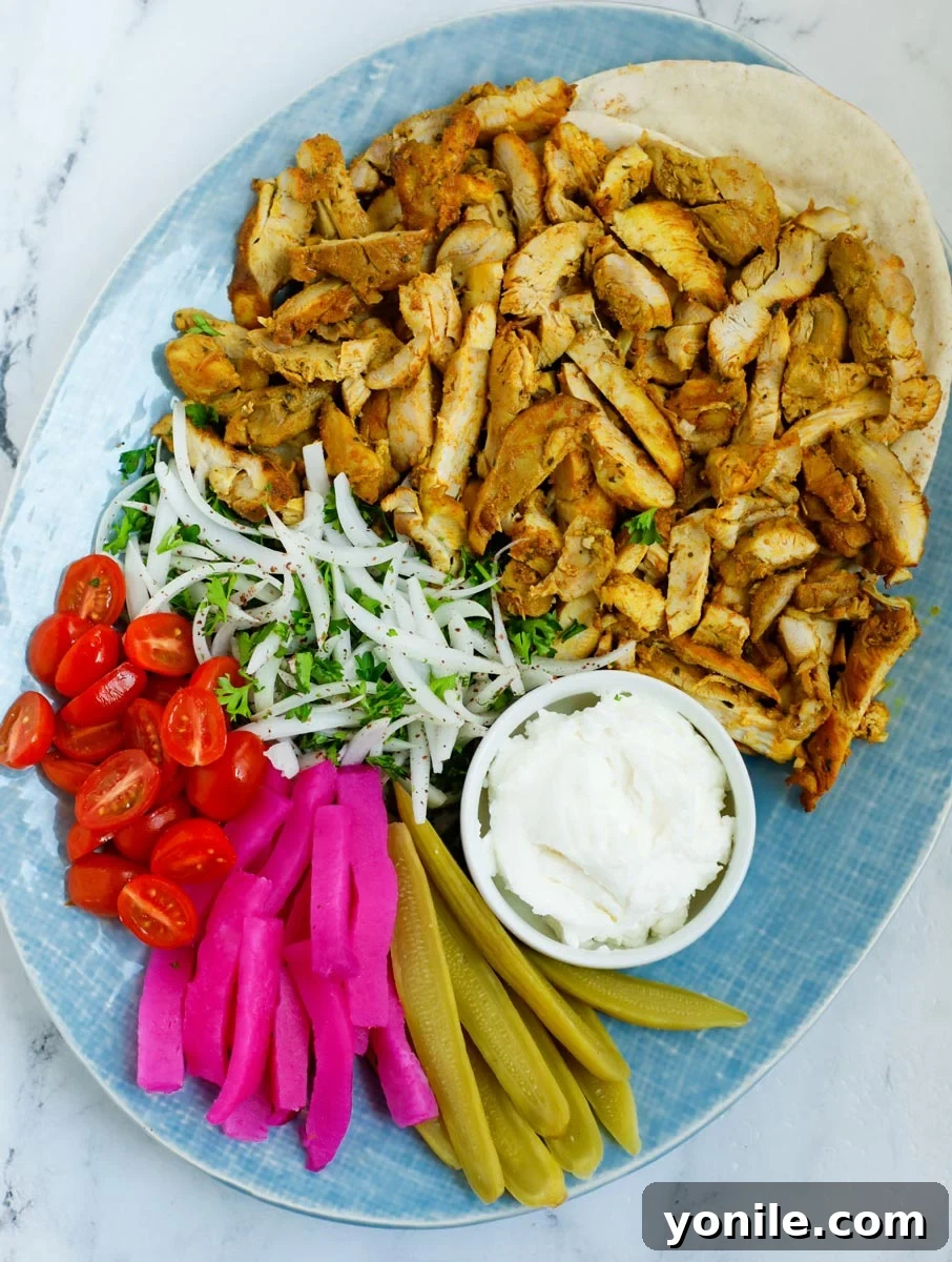 A platter of lebanese chicken shawarma to be served.
