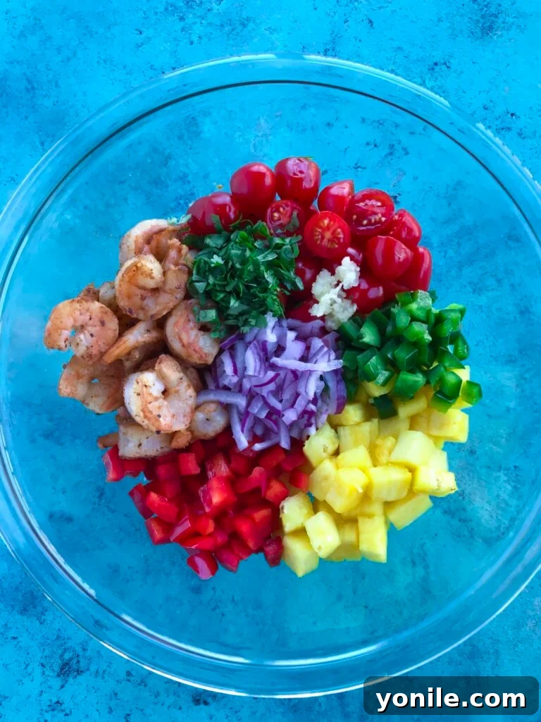 Ingredients for Pineapple Shrimp Salad laid out on a cutting board