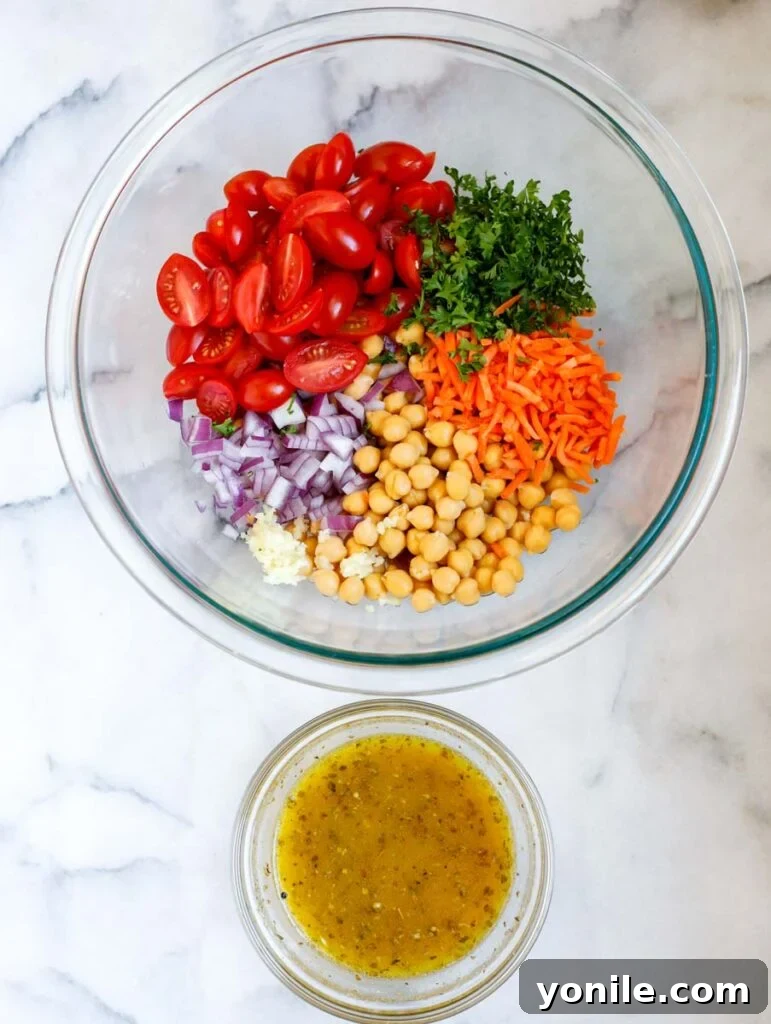 Close-up of fresh ingredients laid out for spinach chickpea salad preparation.