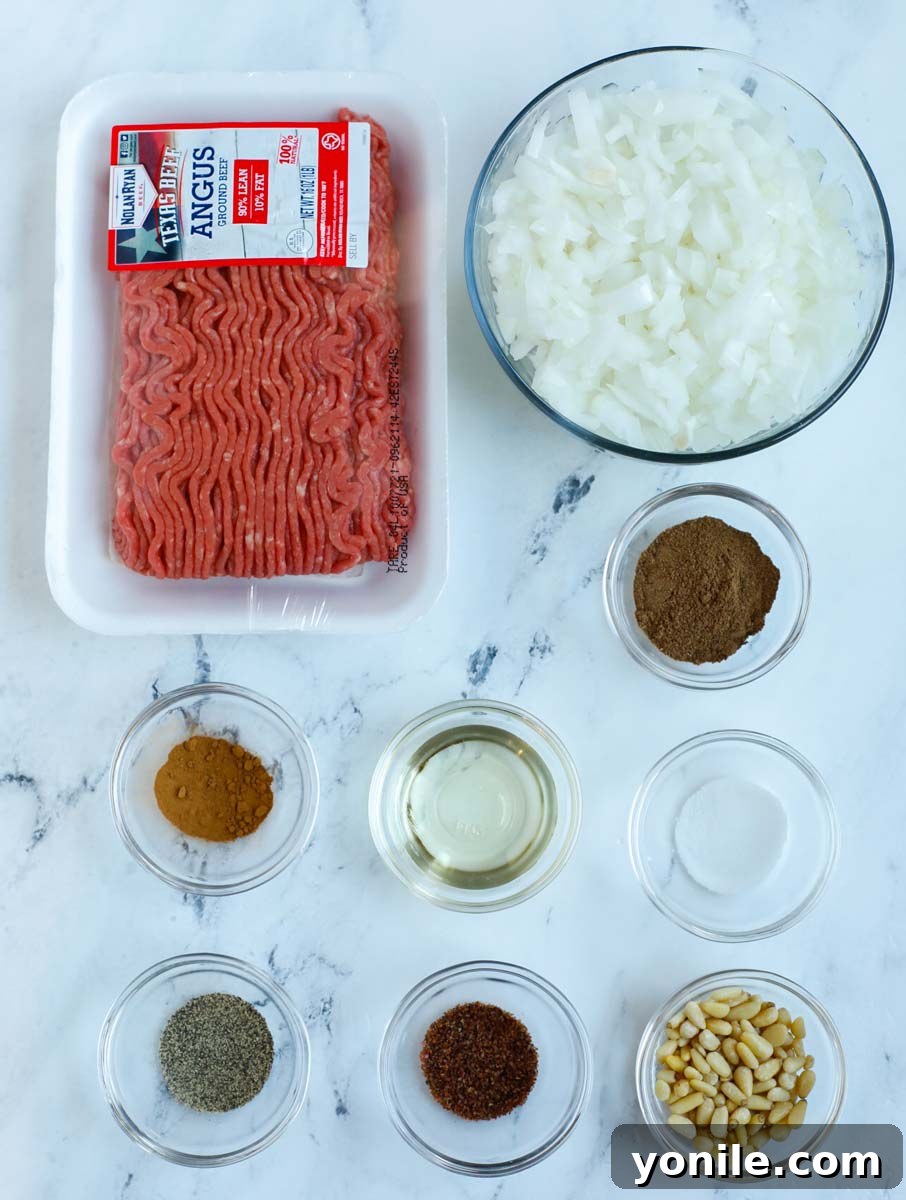 Classic Lebanese Baked Kibbeh 8 spiced beef ingredients laid out