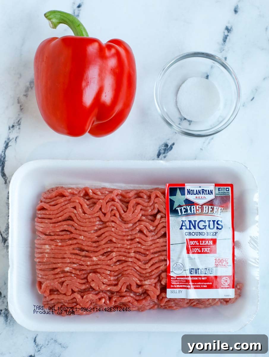 Classic Lebanese Baked Kibbeh 10 ground beef, red bell pepper and salt laid out for beef puree