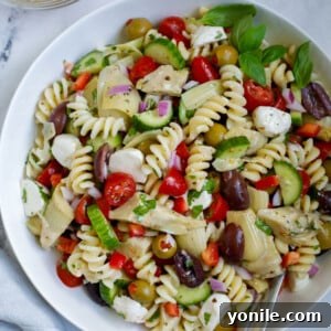 A Mediterranean pasta salad in a bowl.