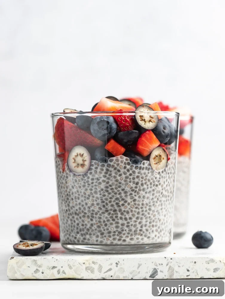 close up shop of chia pudding with berries on top