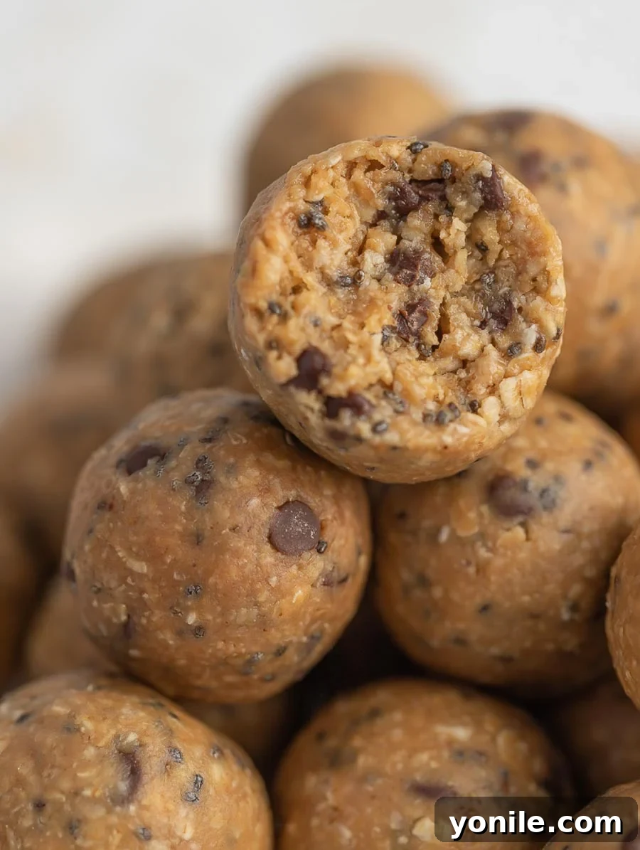Effortless Energy Bites 2 Close-up of a delicious No-Bake Energy Ball with a bite taken out, revealing its wholesome interior.