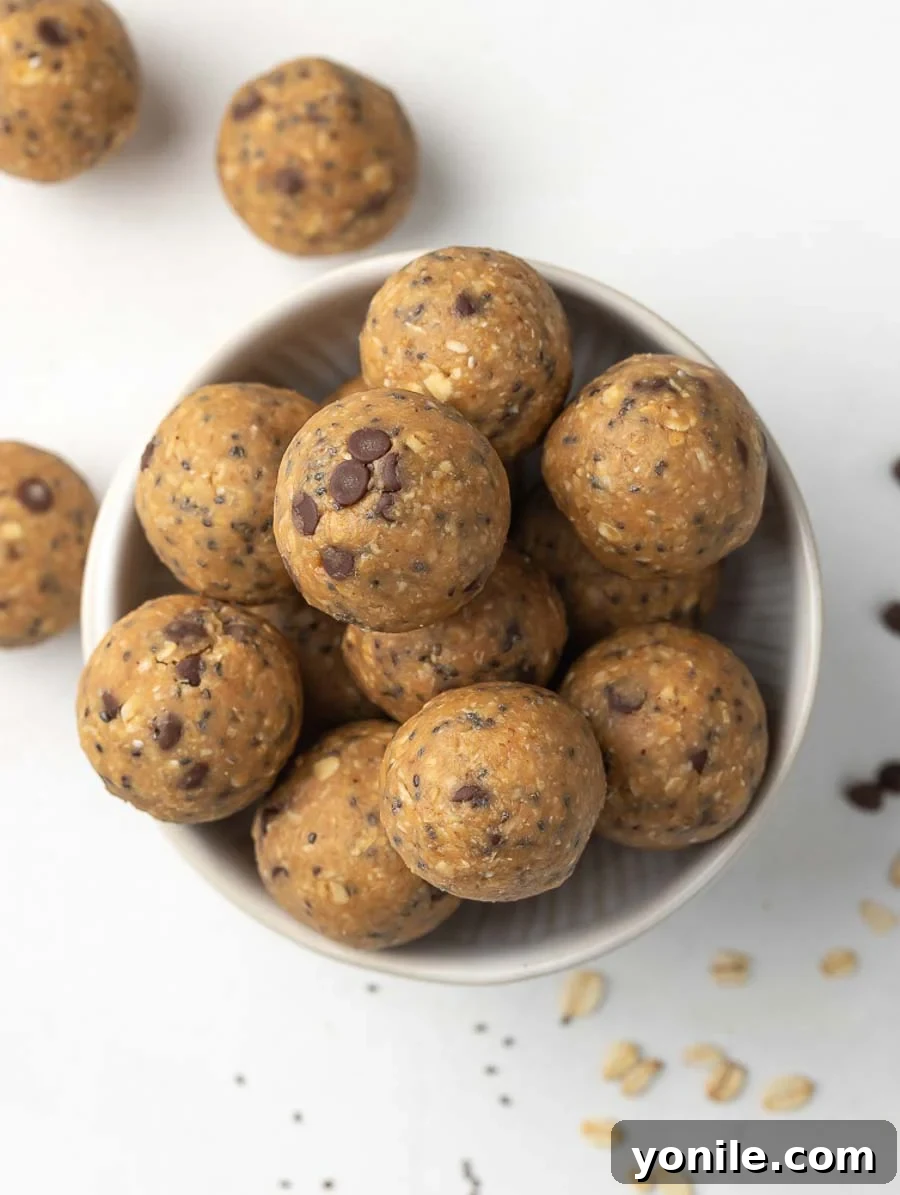 Effortless Energy Bites 7 Top-down shot of a bowl filled with various No-Bake Energy Balls, showcasing their inviting texture.
