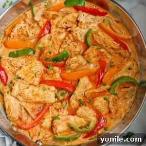Overhead view of a pan of creamy chicken fajita skillet.