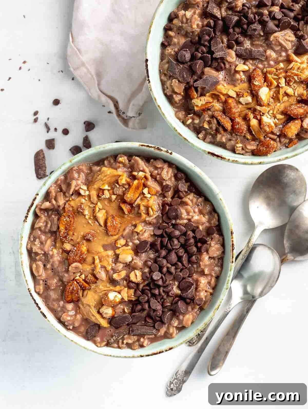 Cocoa Peanut Butter Bliss Bowl 6 two chocolate bowls of oats topping with nuts and chocolate chips