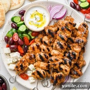 top down shot of the lemon garlic chicken skewers styled on a plate
