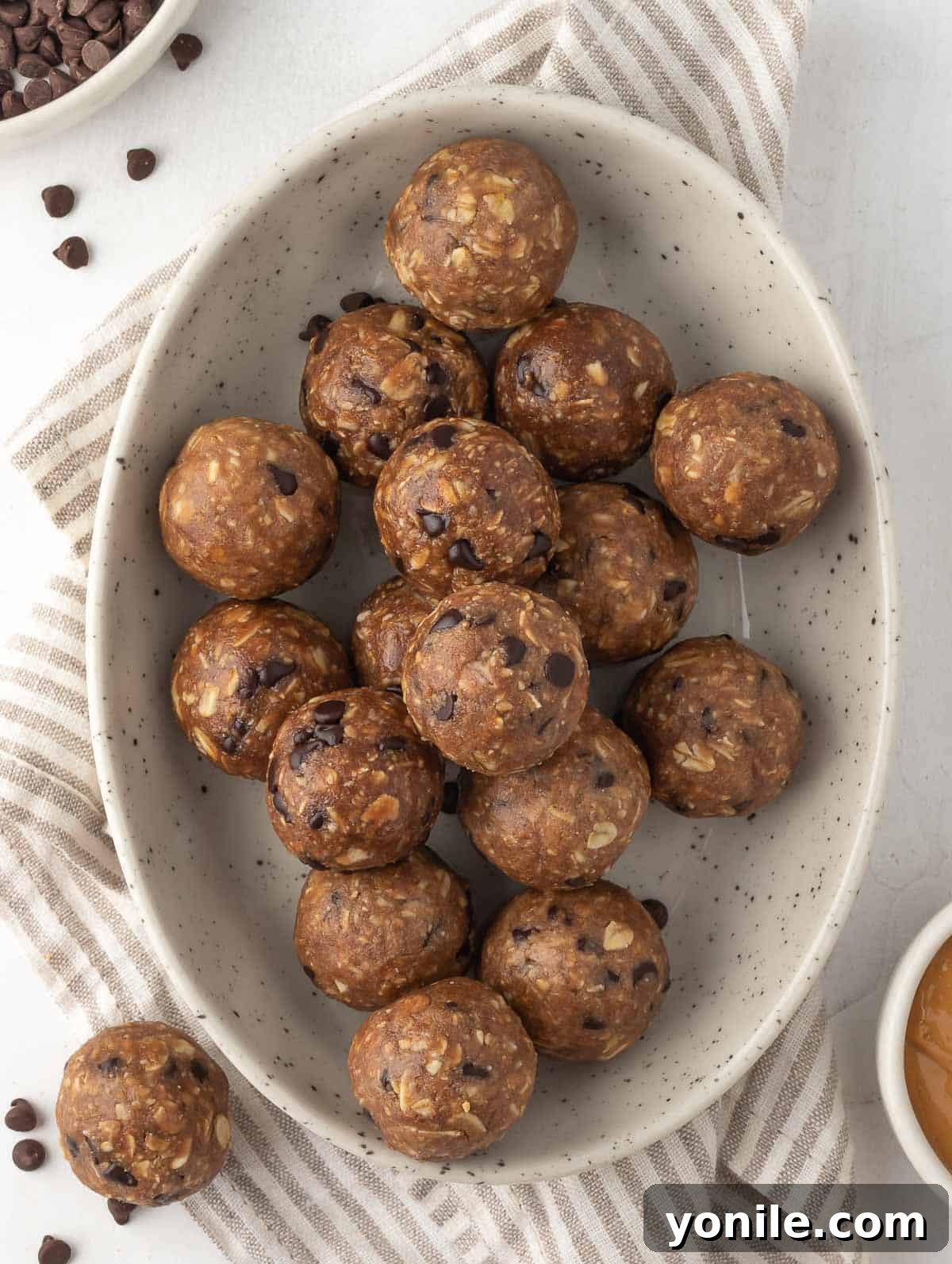 Delicious chocolate peanut butter protein balls artfully arranged in a bowl, ready to be enjoyed as a healthy snack or breakfast.
