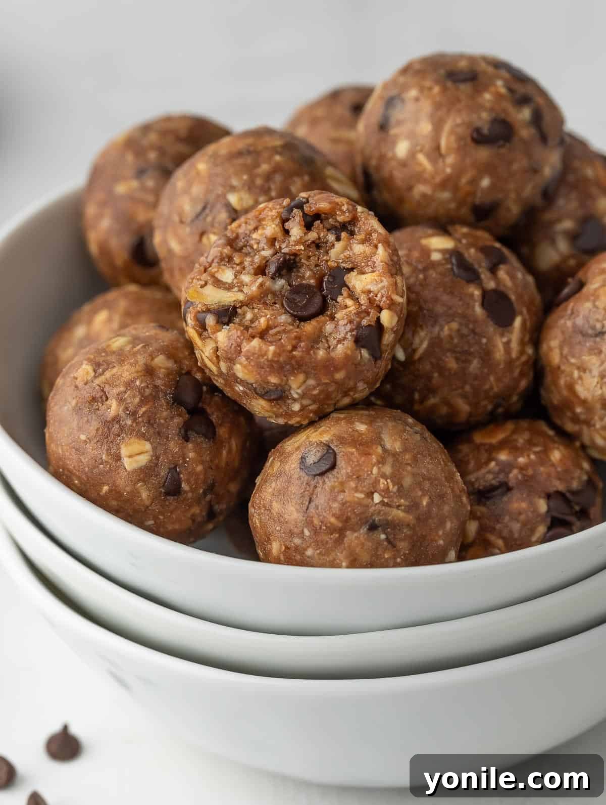 Close-up of protein bites in a bowl, showcasing their inviting texture and rich chocolate and peanut butter blend.