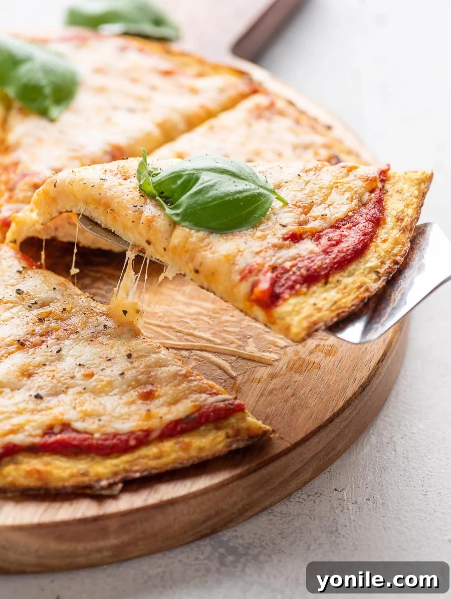 piece of pizza being lifted with a spatula