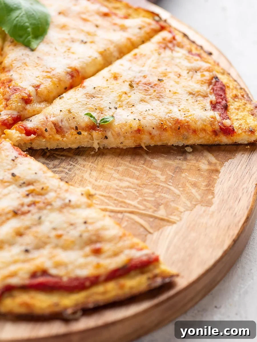 close up shot showing a slice of cauliflower pizza