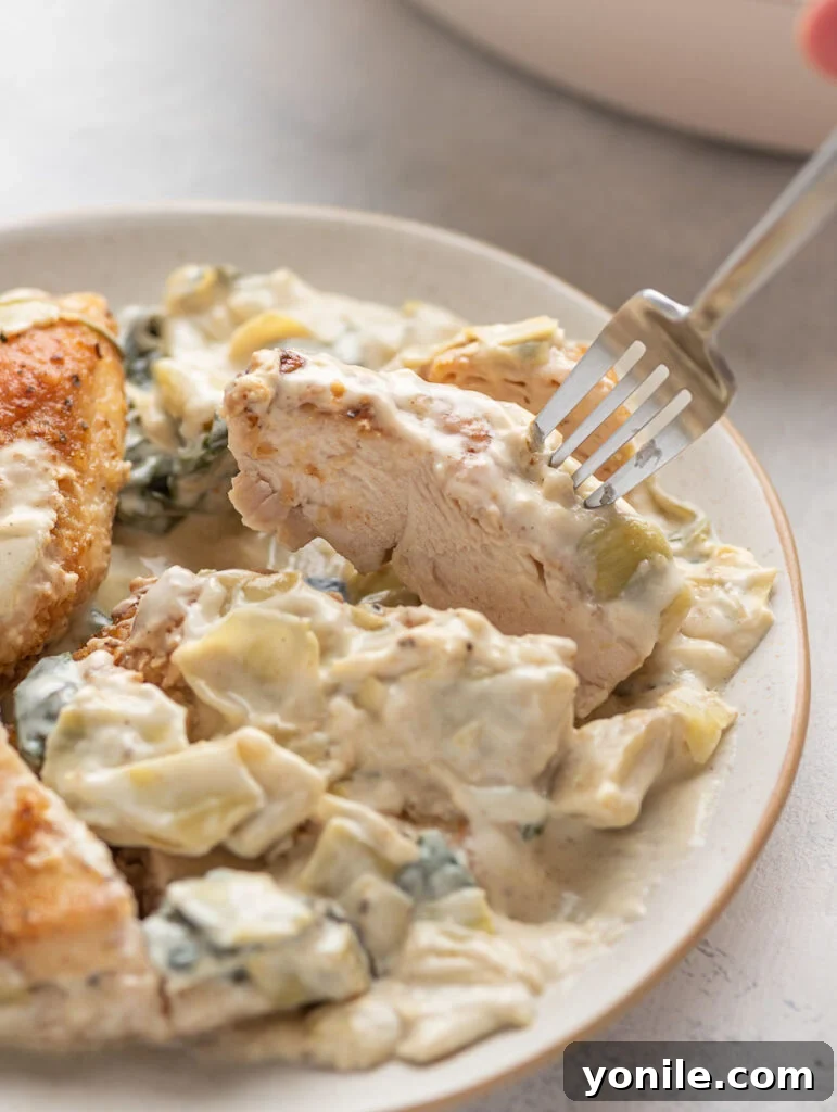 creamy spinach artichoke cut through to show the center