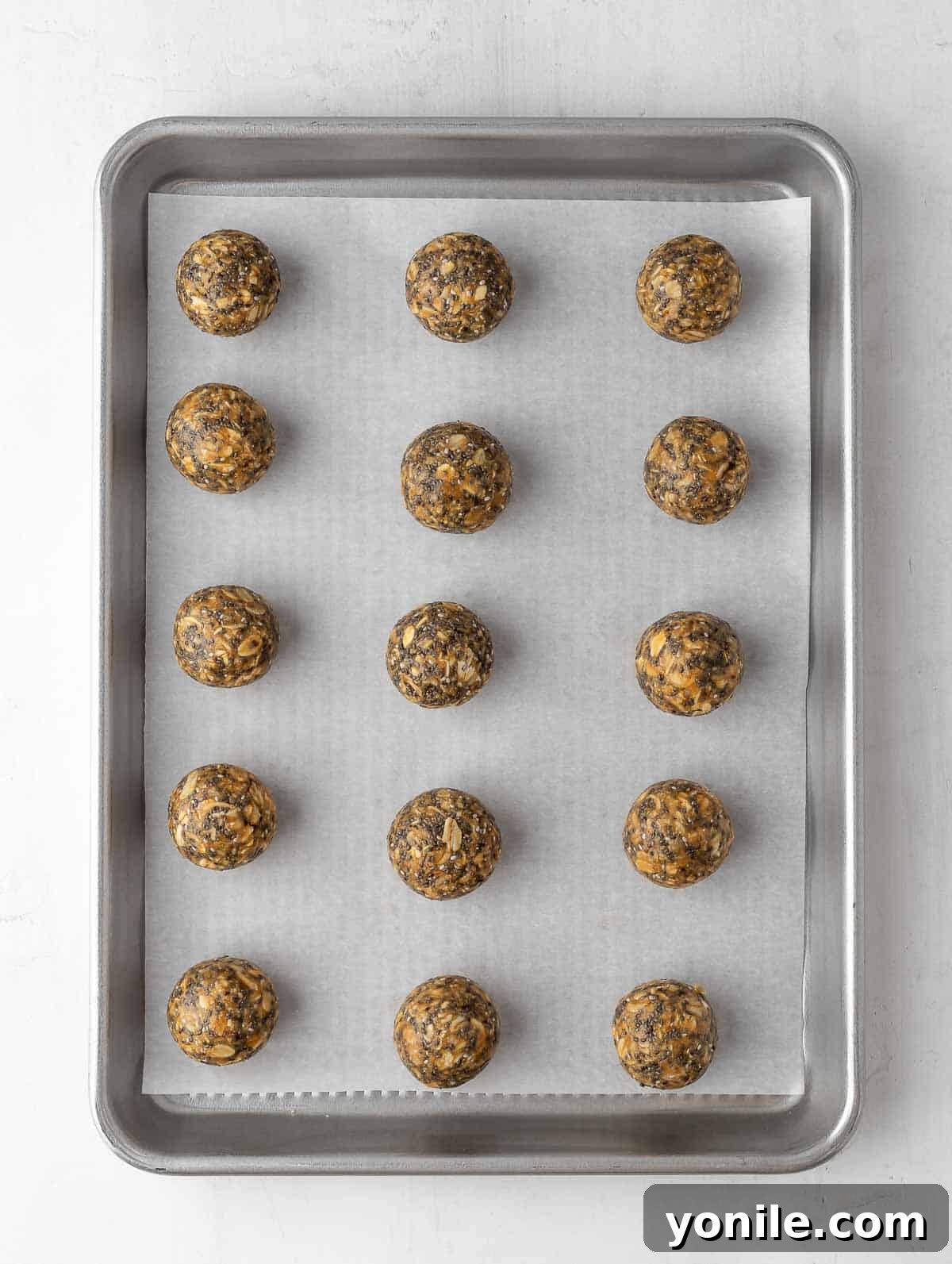 Vanilla Fuel Bites 6 energy balls laid out on a sheet pan to cool