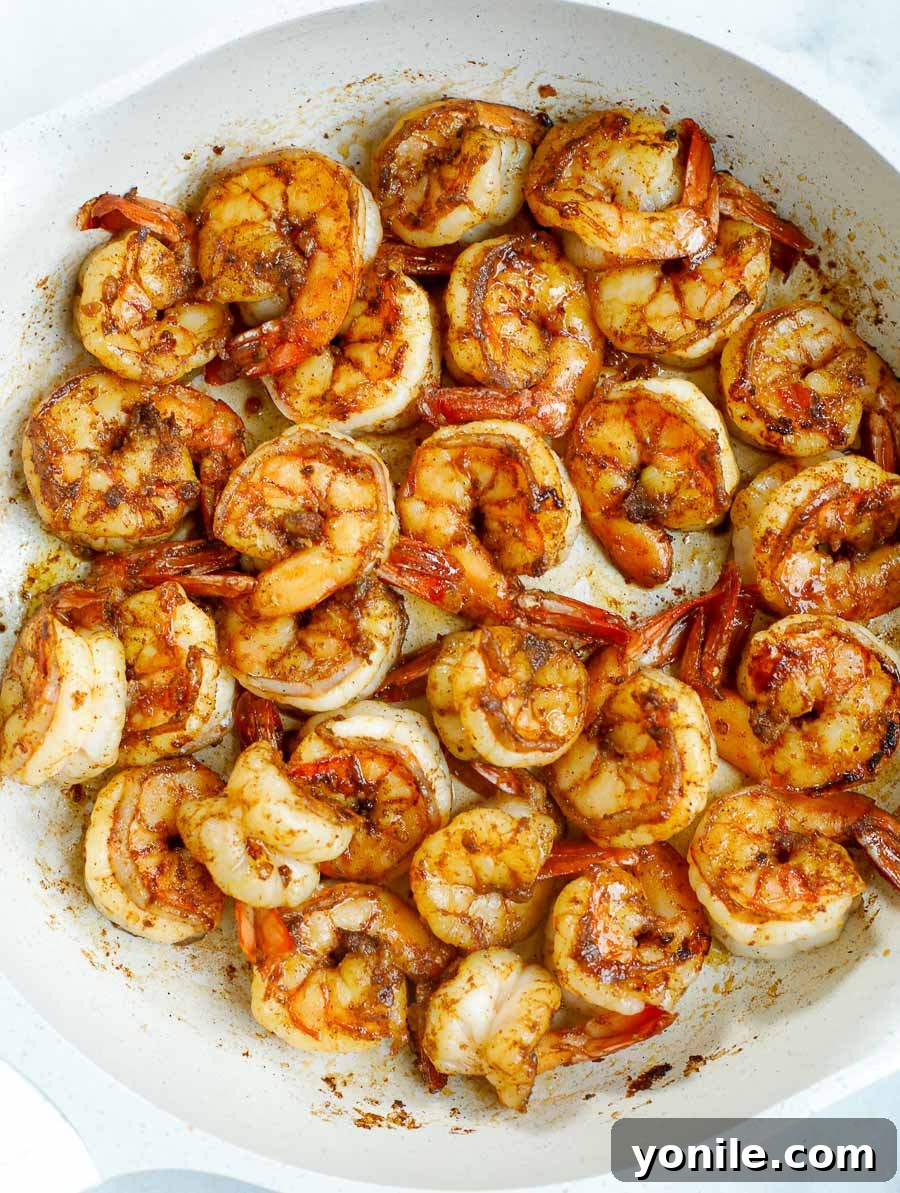 Sautéed chipotle shrimp cooking in a hot skillet, showing a beautiful sear and vibrant color.