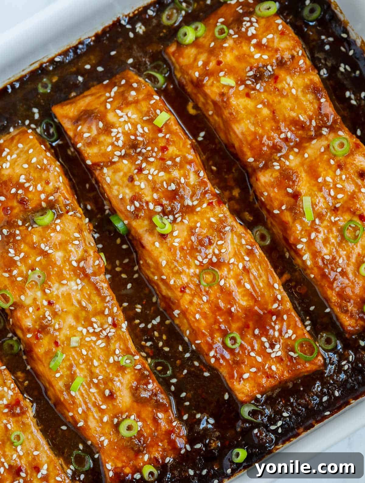 Golden Teriyaki Salmon Bake 2 A perfectly baked teriyaki salmon fillet, glistening with sauce in a baking dish, ready to be served.